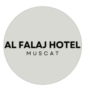 Circular logo for Al Falaj Hotel Muscat in bold black lettering on a light grey background, Al Hamriyah, Muscat