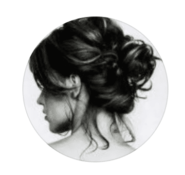 Black and white circular image of a woman with an elegant updo hairstyle, representing Vibes Hair and Beauty salon in Madinat Sultan Qaboos, Muscat