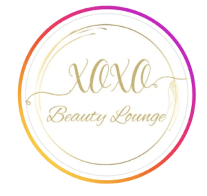 Circular logo for XOXO Beauty Lounge in gold script lettering with a pink and orange gradient border, based in Muscat Hills, Muscat