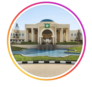 Exterior view of Wyndham Garden Salalah Mirbat hotel showing a grand arched entrance, ornamental pool and landscaped grounds, Salalah, Oman