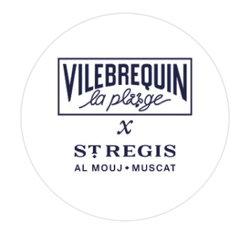 Circular white logo for Vilebrequin la Plage x St Regis Al Mouj Muscat in navy blue, a beach club at the St Regis resort, Al Mouj, Muscat