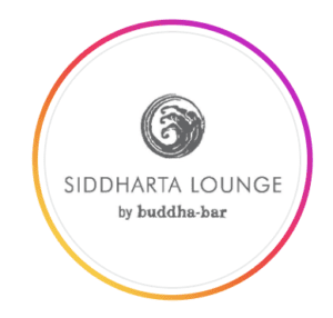 Circular white logo for Siddharta Lounge by Buddha-Bar with a grey spiral emblem and pink and orange gradient border, at W Muscat, Shatti Al Qurum, Muscat