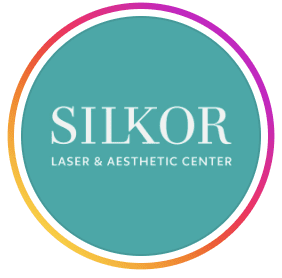 Circular teal logo for Silkor Laser and Aesthetic Centre in white lettering with a pink and orange gradient border, Shatti Al Qurum, Muscat